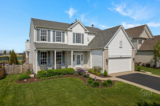 2027 Heatherstone Ct, Plainfield, IL 60586 - traditional-style house featuring a porch, asphalt driveway, an attached garage, brick siding, and a shingled roof