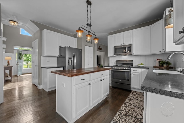 2027 Heatherstone Ct, Plainfield, IL 60586 - kitchen with appliances with stainless steel finishes, a sink, wooden counters, dark wood-style floors, and white cabinetry
