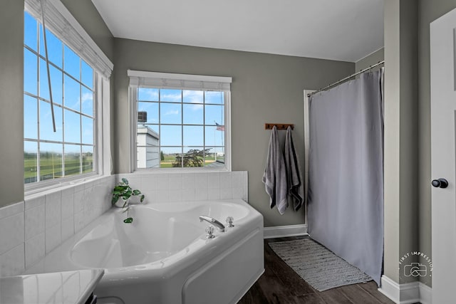 2027 Heatherstone Ct, Plainfield, IL 60586 - bathroom with a garden tub, baseboards, wood finished floors, and curtained shower