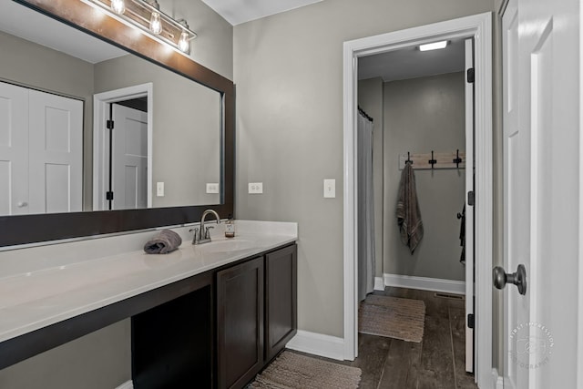 2027 Heatherstone Ct, Plainfield, IL 60586 - bathroom featuring vanity, wood finished floors, and baseboards