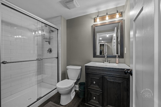 2027 Heatherstone Ct, Plainfield, IL 60586 - bathroom with toilet, a shower stall, vanity, and wood finished floors