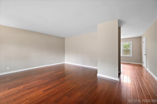 16 Circle Dr E, Montgomery, IL 60538 - empty room featuring baseboards and dark wood finished floors