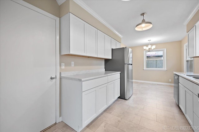 16 Circle Dr E, Montgomery, IL 60538 - kitchen featuring a chandelier, light countertops, stainless steel appliances, and crown molding