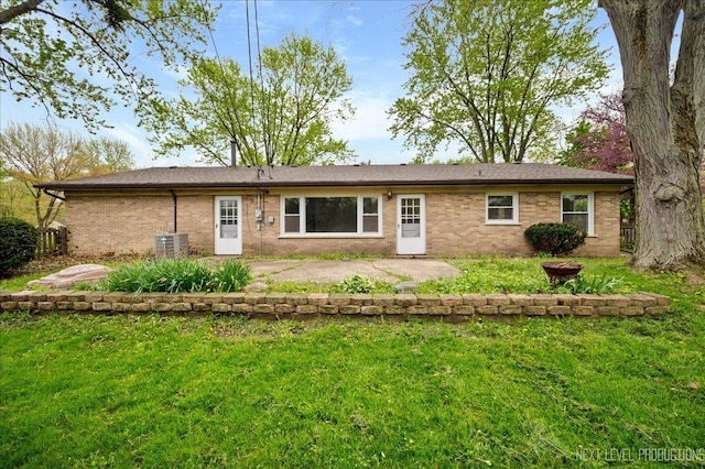 16 Circle Dr E, Montgomery, IL 60538 - back of property with brick siding, central AC, and a lawn