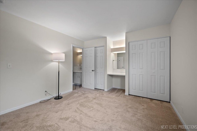 16 Circle Dr E, Montgomery, IL 60538 - unfurnished bedroom featuring baseboards, two closets, and carpet floors
