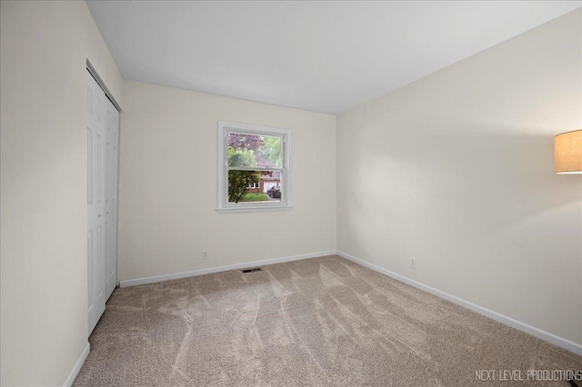 16 Circle Dr E, Montgomery, IL 60538 - unfurnished bedroom with carpet, baseboards, and a closet
