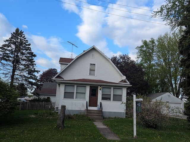 view of front facade featuring a front lawn, fence, and entry steps