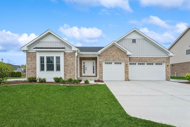9014 Gloucester Rd, Woodridge, IL 60517 - view of front of house with driveway, brick siding, a front yard, an attached garage, and board and batten siding