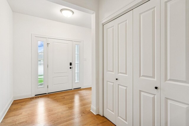 9014 Gloucester Rd, Woodridge, IL 60517 - foyer with light wood-style floors and baseboards