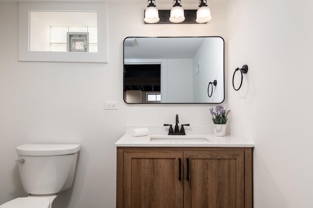 half bath with toilet and vanity