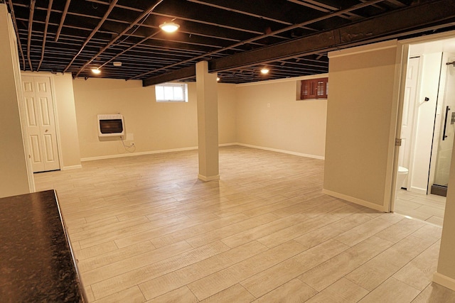 10145 Lawrence Ct, Oak Lawn, IL 60453 - below grade area with heating unit, wood finished floors, and baseboards