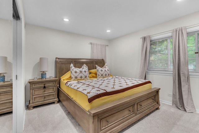 bedroom featuring light colored carpet, baseboards, and recessed lighting