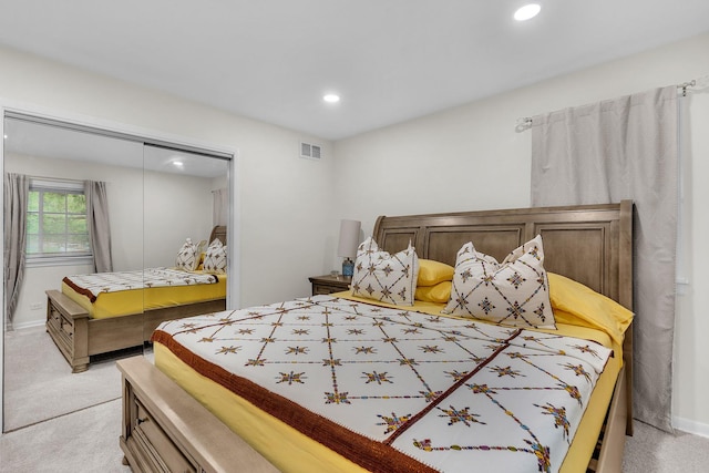 bedroom featuring light colored carpet, a closet, visible vents, and recessed lighting