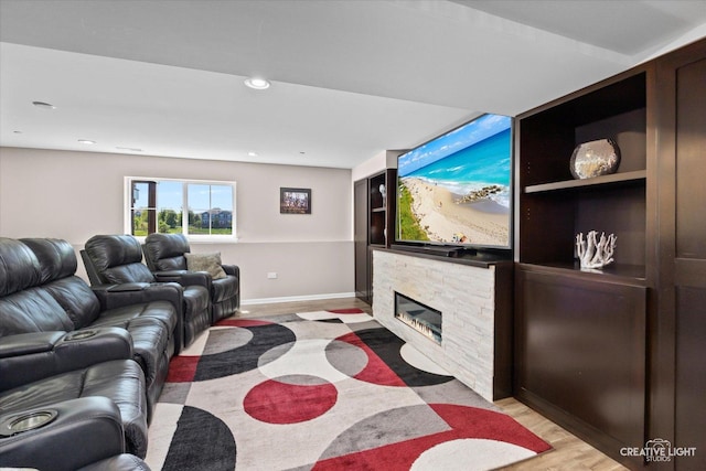 9692 Baumgartner St, Huntley, IL 60142 - living room with a stone fireplace, recessed lighting, and baseboards