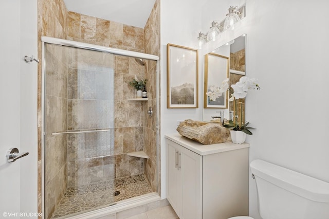 bathroom with a shower stall and toilet