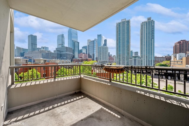 balcony featuring a skyline view