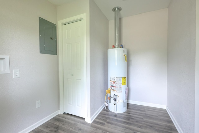211 N Center St, Buda, IL 61314 - utility room with water heater and electric panel