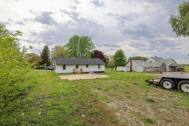 211 N Center St, Buda, IL 61314 - view of grassy yard with a patio area
