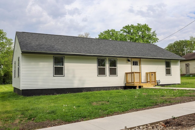 211 N Center St, Buda, IL 61314 - view of front of house featuring a front yard and roof with shingles