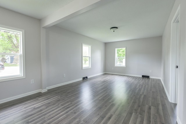 211 N Center St, Buda, IL 61314 - unfurnished room featuring dark wood-style flooring and baseboards