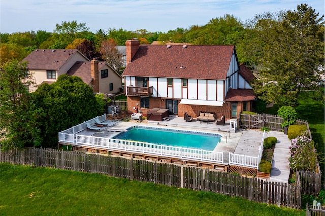 1352 Goldenrod Dr, Naperville, IL 60540 - rear view of house featuring outdoor lounge area, brick siding, a balcony, a chimney, and a patio area