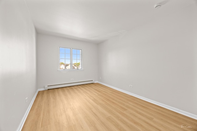17963 Huntleigh Ct Unit 302, Country Club Hills, IL 60478 - empty room featuring a baseboard radiator, light wood-style floors, baseboards, and a smoke detector
