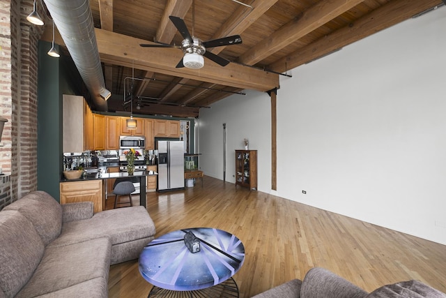 2735 W Armitage Ave Unit 309, Chicago, IL 60647 - living area with light wood finished floors, wood ceiling, ceiling fan, and beam ceiling