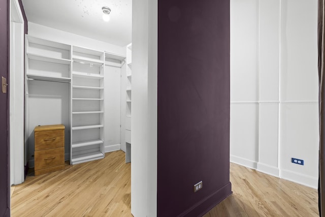 2735 W Armitage Ave Unit 309, Chicago, IL 60647 - walk in closet featuring wood finished floors