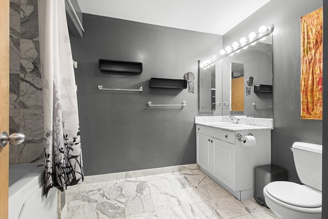 2735 W Armitage Ave Unit 309, Chicago, IL 60647 - bathroom with toilet, shower / bath combo with shower curtain, marble finish floor, vanity, and baseboards