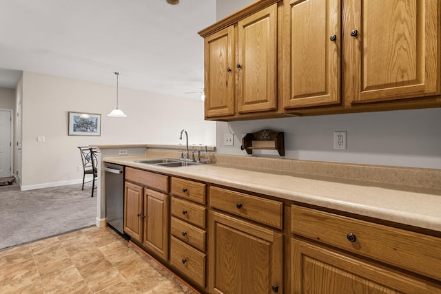 kitchen with a sink, dishwasher, brown cabinetry, and light countertops