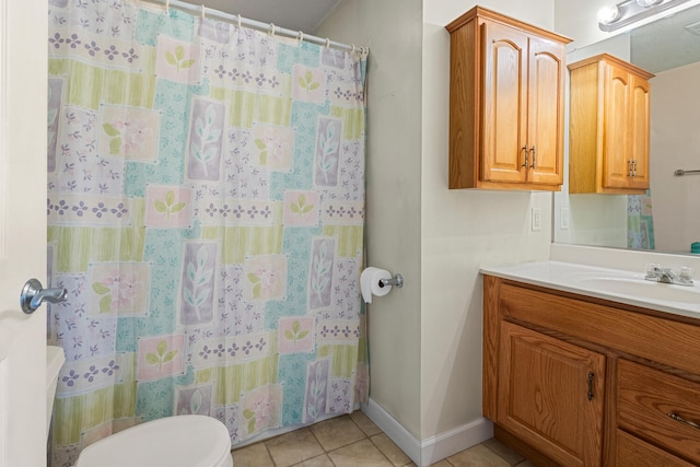 full bath featuring tile patterned flooring, toilet, vanity, baseboards, and curtained shower