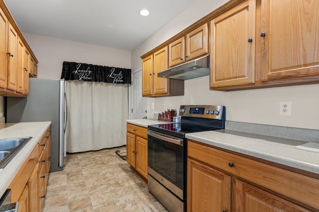 kitchen featuring appliances with stainless steel finishes, under cabinet range hood, light countertops, recessed lighting, and brown cabinets