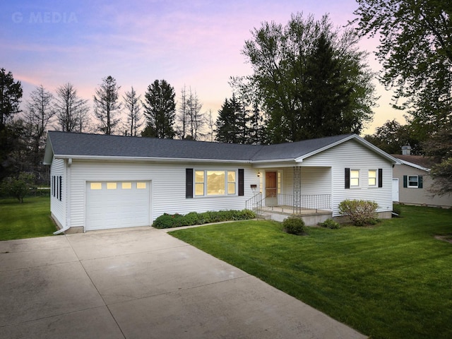 200 W Eisenhower St, Waterman, IL 60556 - ranch-style house with driveway, a porch, an attached garage, and a front yard