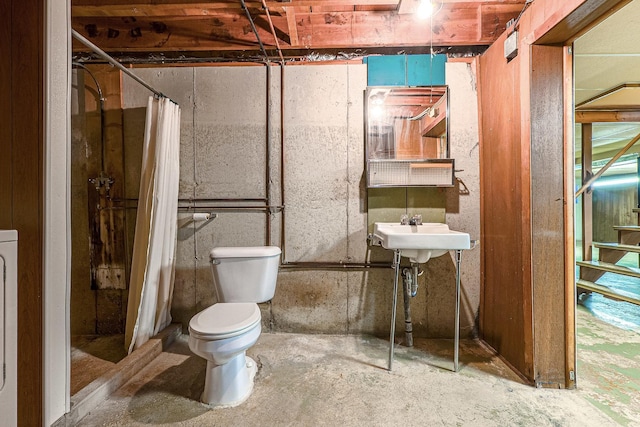 200 W Eisenhower St, Waterman, IL 60556 - full bath with concrete floors, toilet, a shower with shower curtain, and a sink