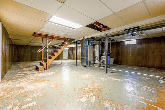 200 W Eisenhower St, Waterman, IL 60556 - basement with a drop ceiling, wooden walls, and stairs