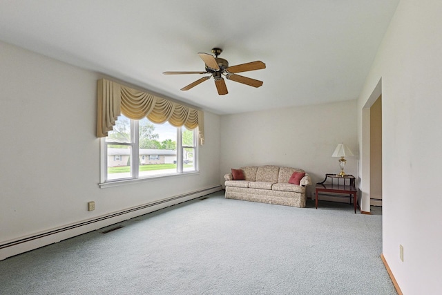 200 W Eisenhower St, Waterman, IL 60556 - living area featuring a baseboard radiator, carpet floors, and a ceiling fan
