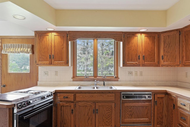 200 W Eisenhower St, Waterman, IL 60556 - kitchen featuring light countertops, paneled dishwasher, a sink, and electric range
