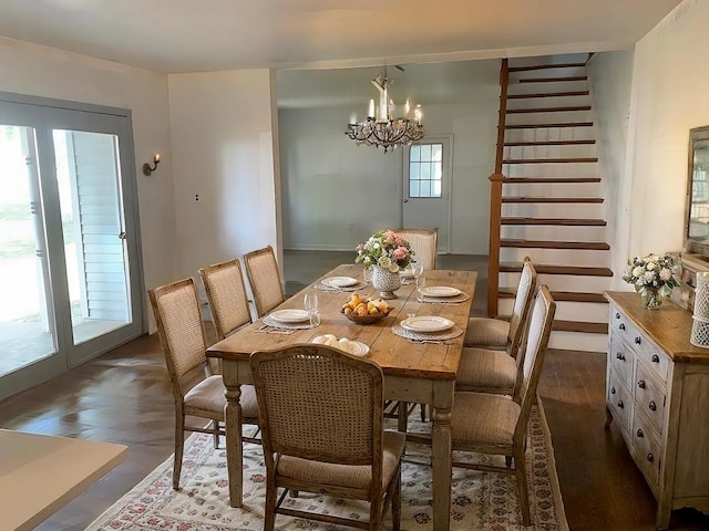 642 Angling Rd, Paw Paw, IL 61353 - dining area featuring a chandelier, dark wood finished floors, and stairway