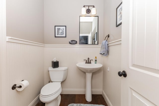9760 Janel Dr, Bloomington, IL 61705 - half bathroom with a wainscoted wall, toilet, and a sink