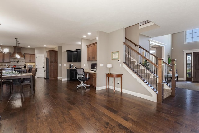 9760 Janel Dr, Bloomington, IL 61705 - living room featuring dark wood-style flooring, stairway, recessed lighting, and baseboards