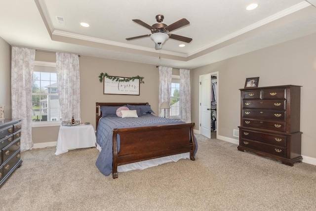 9760 Janel Dr, Bloomington, IL 61705 - bedroom featuring a tray ceiling, ornamental molding, baseboards, light colored carpet, and recessed lighting