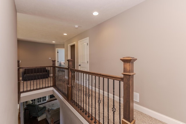9760 Janel Dr, Bloomington, IL 61705 - corridor with carpet flooring, an upstairs landing, recessed lighting, and baseboards