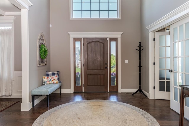 9760 Janel Dr, Bloomington, IL 61705 - foyer featuring a high ceiling, healthy amount of natural light, wood finished floors, and baseboards