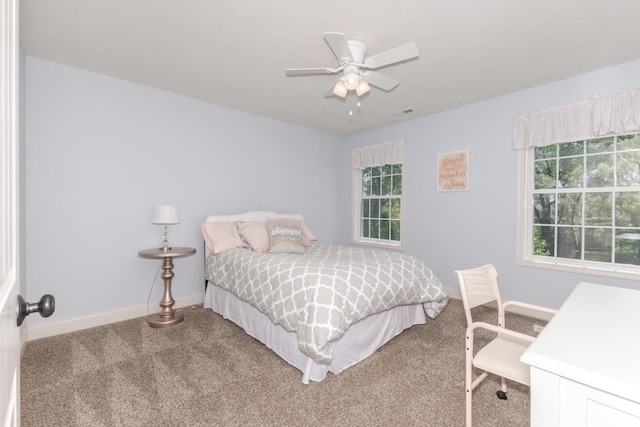 9760 Janel Dr, Bloomington, IL 61705 - bedroom featuring carpet floors, baseboards, and a ceiling fan