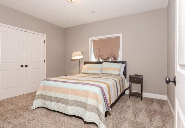 9760 Janel Dr, Bloomington, IL 61705 - bedroom featuring carpet floors, a closet, and baseboards