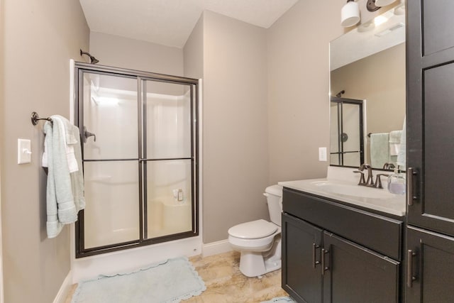 9760 Janel Dr, Bloomington, IL 61705 - full bathroom featuring a shower stall, baseboards, vanity, and toilet