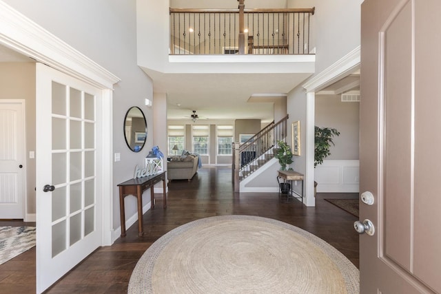 9760 Janel Dr, Bloomington, IL 61705 - entryway featuring stairway, wood finished floors, ceiling fan, and a high ceiling