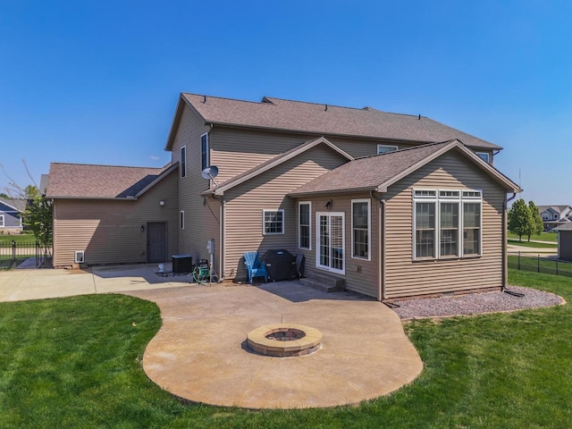 9760 Janel Dr, Bloomington, IL 61705 - back of house featuring a patio, an outdoor fire pit, entry steps, and central AC