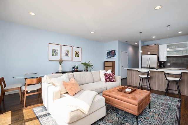 living room with wood finished floors and recessed lighting