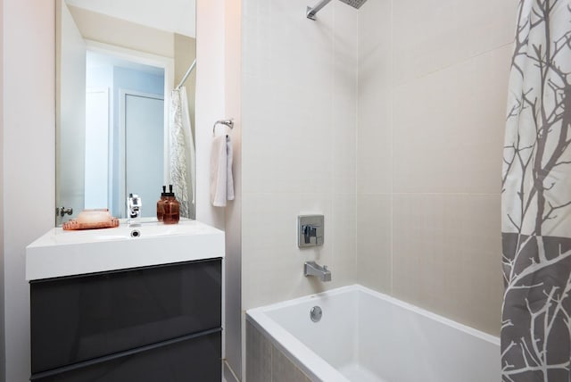 bathroom with shower / bath combo and vanity